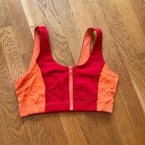 Bandier x solid and striped hide ride bra. Red and orange. Small.